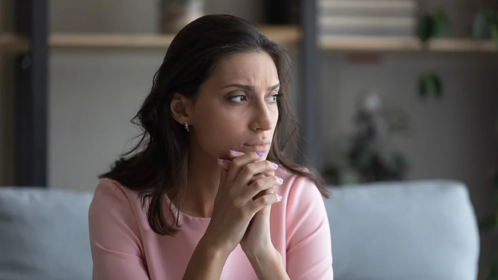 anxious young woman prior to online trauma therapy